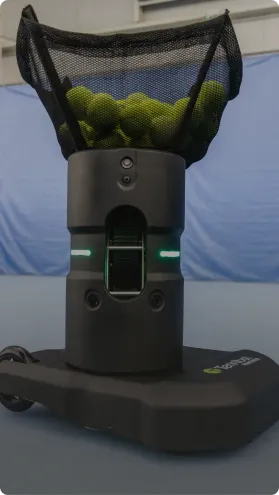 Loading tennis balls back into Partner ball machine
