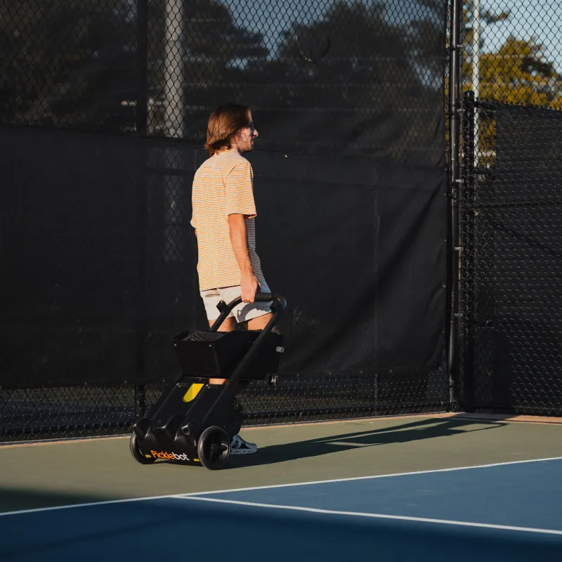 Tennibot Rover pickleball collector carried off court
